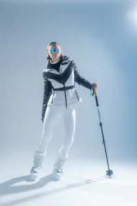 a woman in ski gear posing for a photo